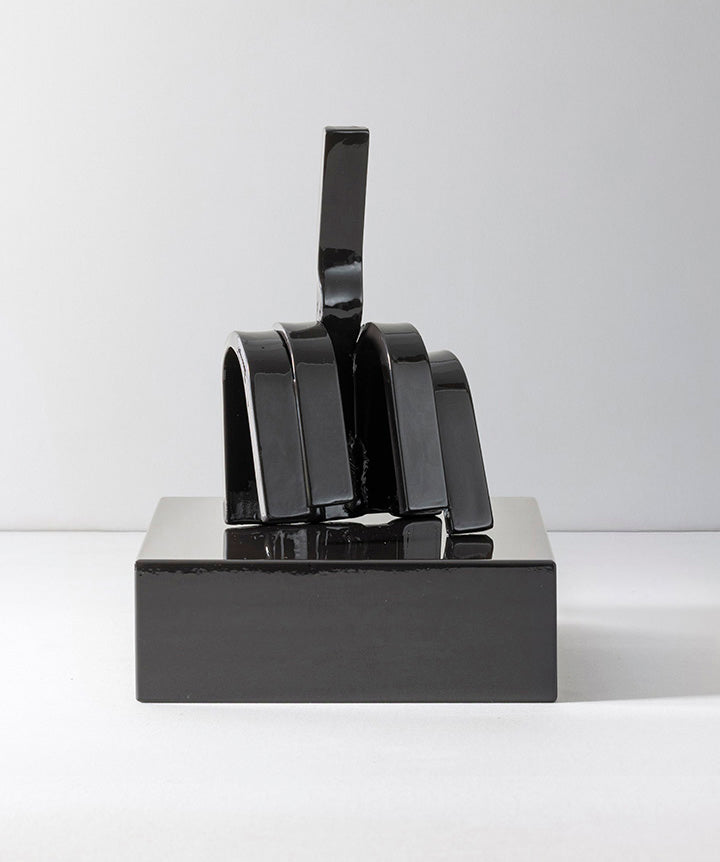 Gesture | Middle finger made from hand sculpted metal set on solid marble base.