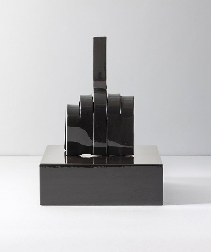 Gesture | Middle finger made from hand sculpted metal set on solid marble base.