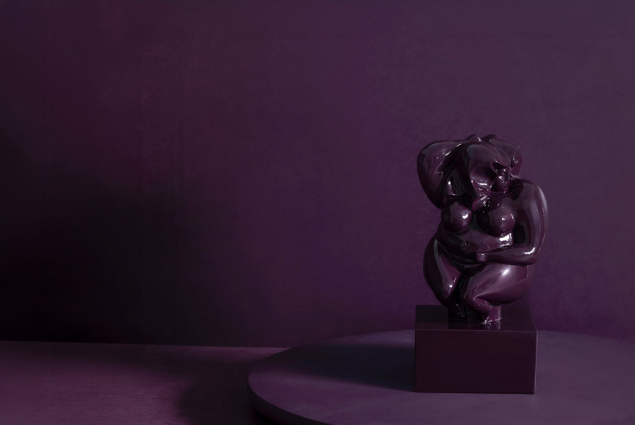 Voluptuous bronze woman on solid marble coated in a custom high gloss urethane-based paint.