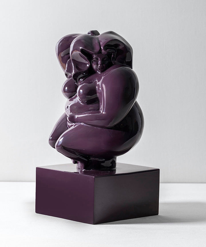 Zoftig Woman | Voluptuous bronze woman on solid marble coated in a custom high gloss urethane-based paint on a white background.