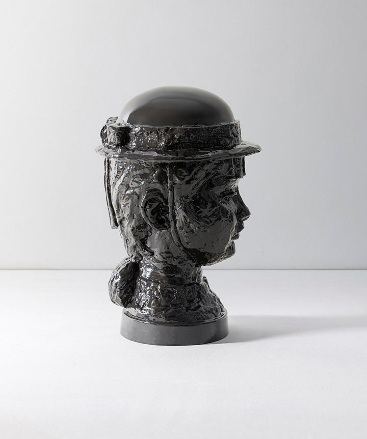 BRUTALIST BEAUTY | Black ceramic bust with helmet on a white background