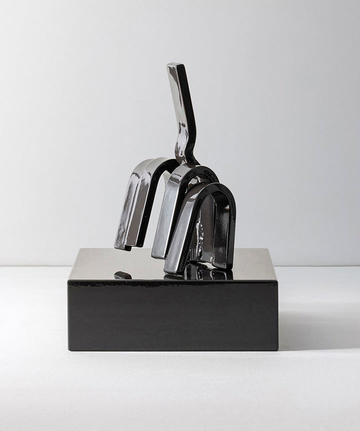 Gesture | Middle finger made from hand sculpted metal set on solid marble base.